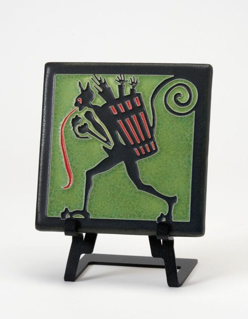 A green ceramic Krampus art tile handmade by Motawi Tileworks.