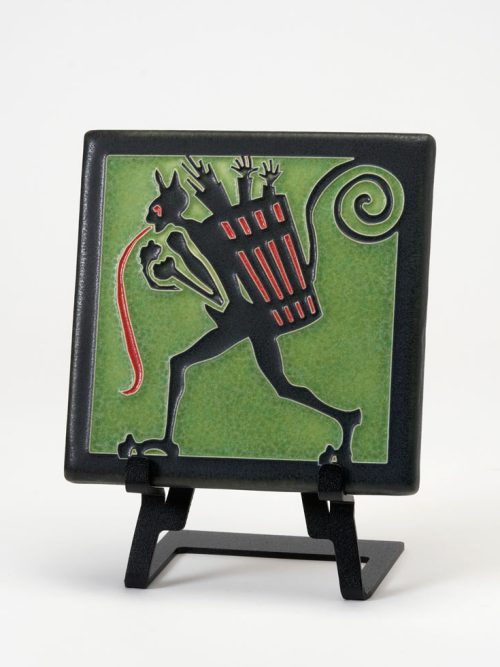 A green ceramic Krampus art tile handmade by Motawi Tileworks.