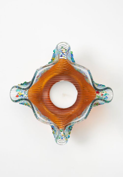 Top view of a glass amber votive.