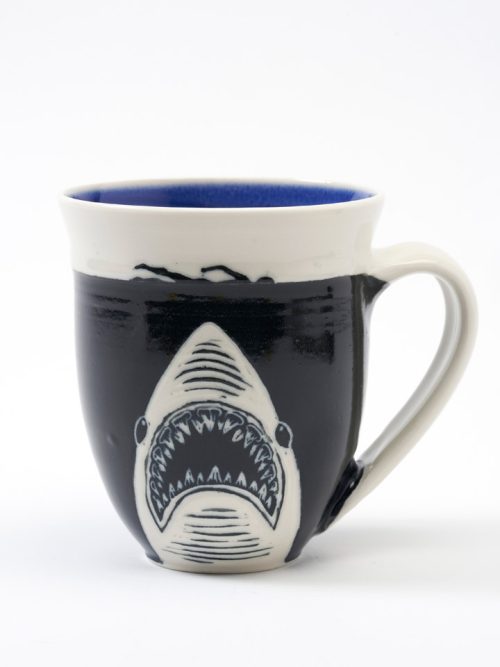 A porcelain shark mug handmade by Asheville potter Anja Bartels.