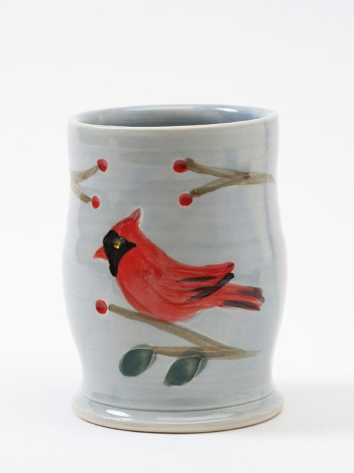 A light gray stoneware cardinal tumbler handmade by Bluegill Pottery of North Carolina.