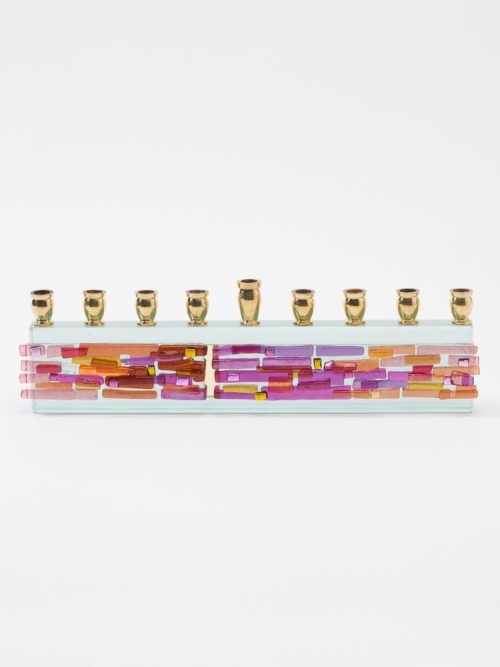 A fused glass parting of the sea menorah by Alicia Kelemen.