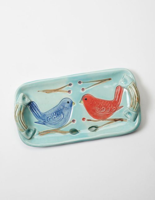 A stoneware folk bird tray by Vicki Gill of Bluegill Pottery.