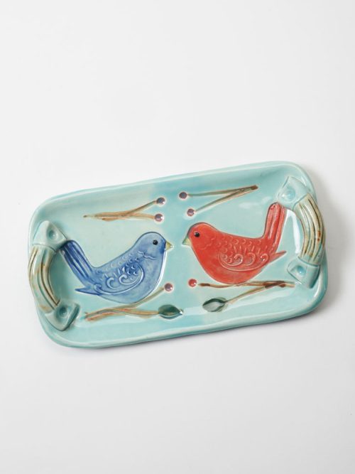 A stoneware folk bird tray by Vicki Gill of Bluegill Pottery.