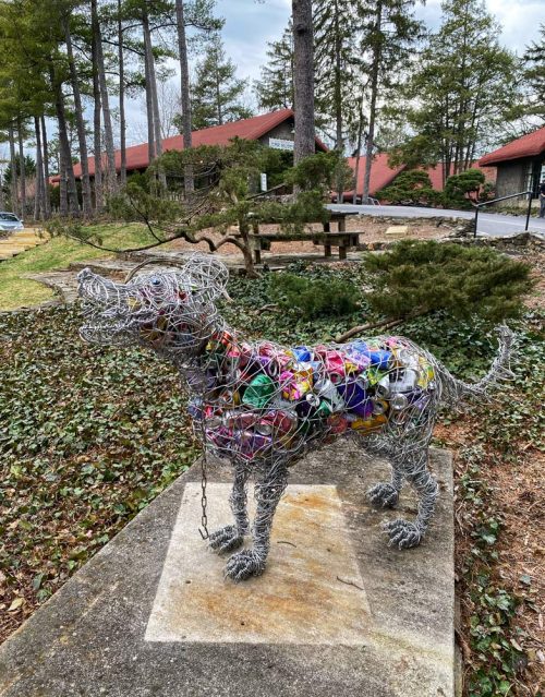 Wire dog sculpture.