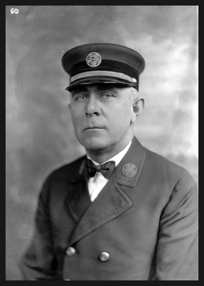 Portrait of Alonzo L. Duckett, Asheville fire chief, in his uniform.