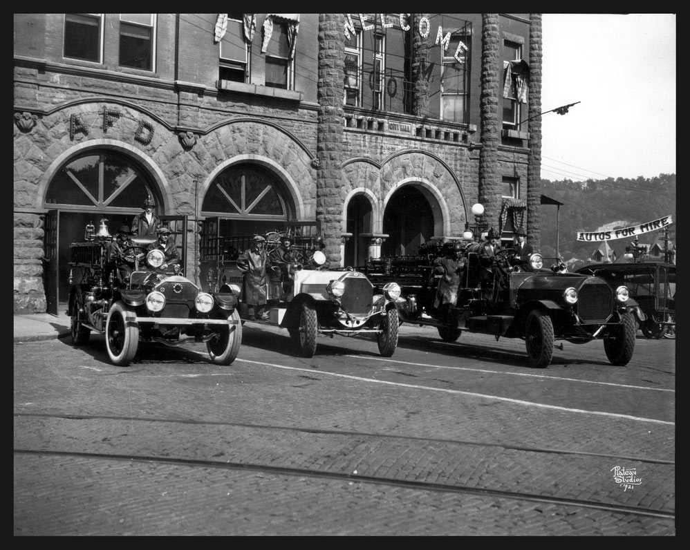 1920s photo of fire trucks in front of Asheville City Hall.