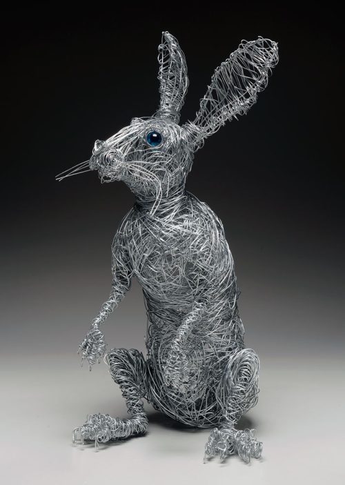 Wire rabbit sculpture titled Follow the White Rabbit by Josh Cote.