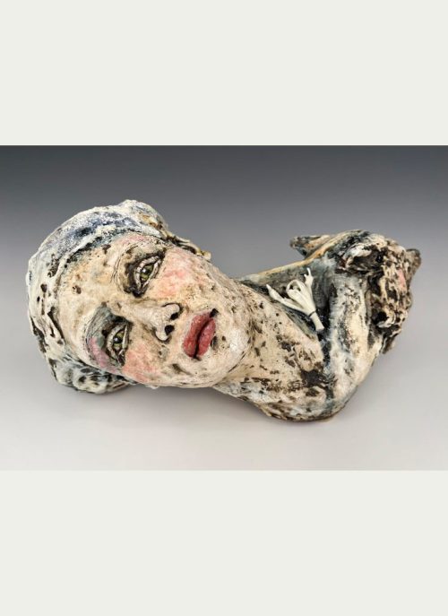 A stoneware clay sculpture featuring a woman and wolf's head by Asia Mathis titled Ancestors.