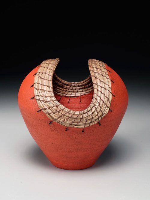Ceramic burnt orange heart vessel by Hannie Goldgewicht.