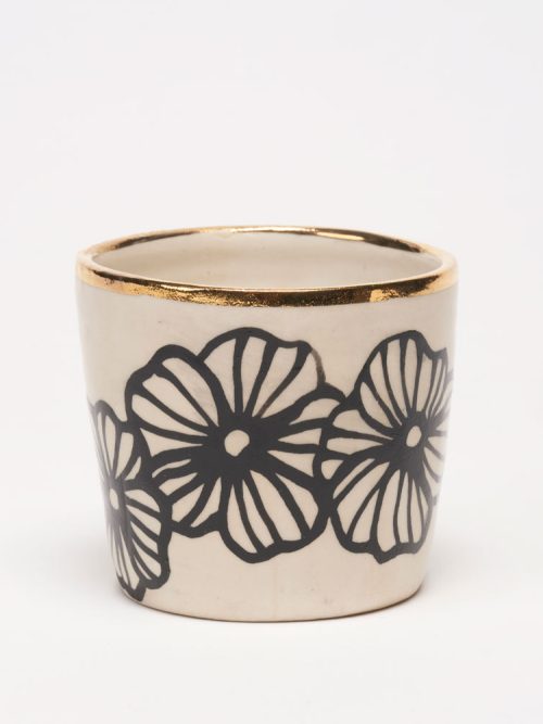 Floral tumbler with gold accents by Nicole Hsieh.