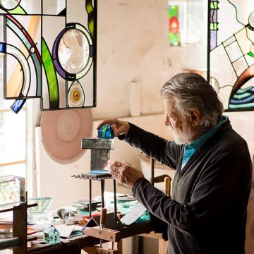 Glass artist Carl Powell in his Grovewood Village studio.