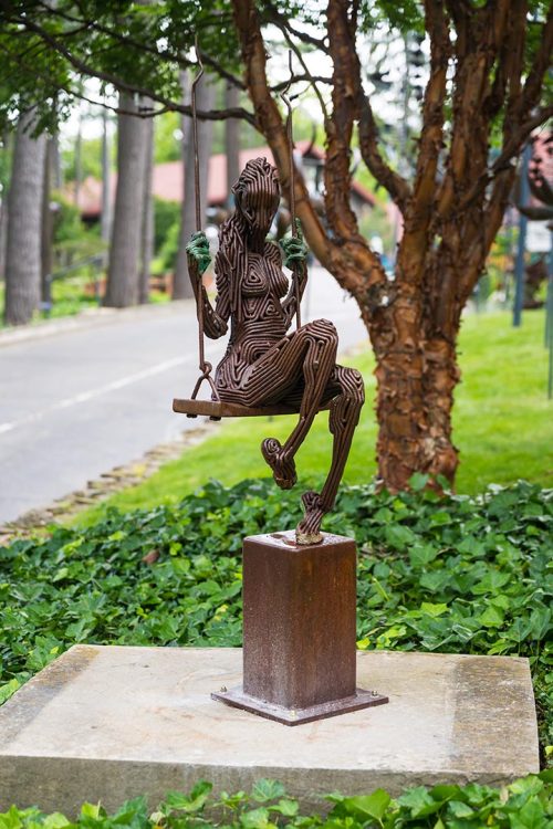 An outdoor sculpture by J. Aaron Alderman titled She Came to Me in Spring.
