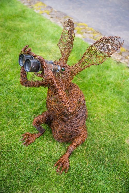 An outdoor wire sculpture titled Bunnoculars by artist Josh cote.