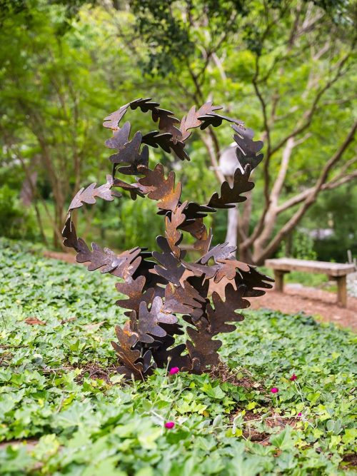 An outdoor sculpture by artist Bob Doster titled Winter Leaves.