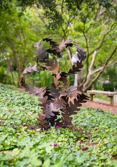 An outdoor sculpture by artist Bob Doster titled Winter Leaves.