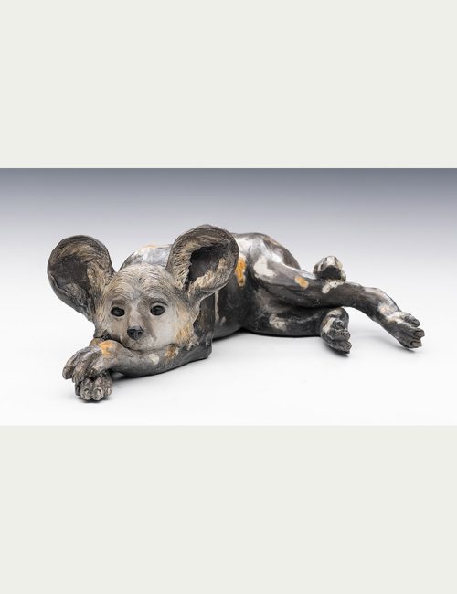 African wild dog pup sculpture by artist Tina Curry.