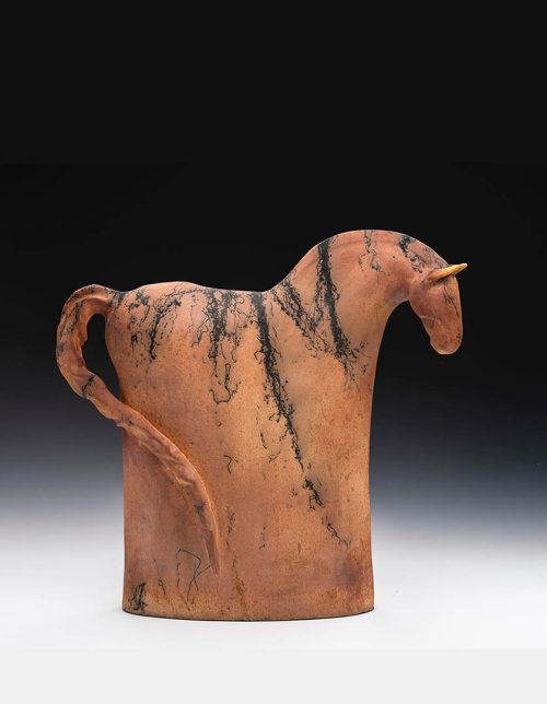 A ceramic horse sculpture by artist Tina Curry titled Follow Me.