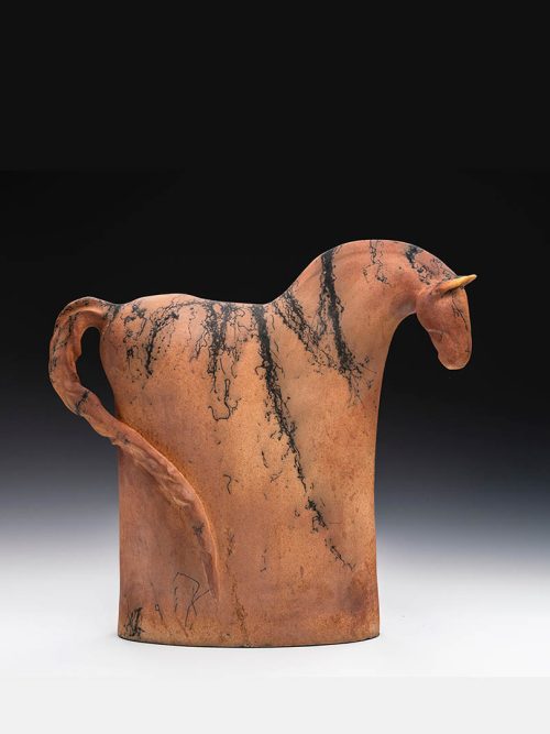 A ceramic horse sculpture by artist Tina Curry titled Follow Me.