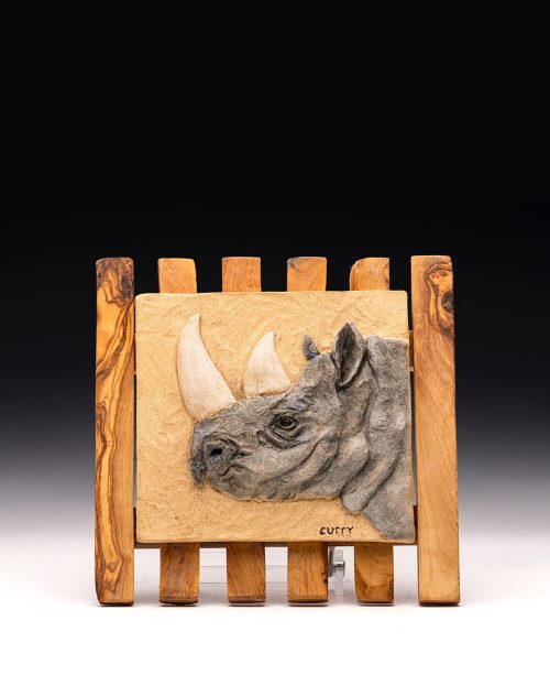 Rhino relief tile by artist Tina Curry.