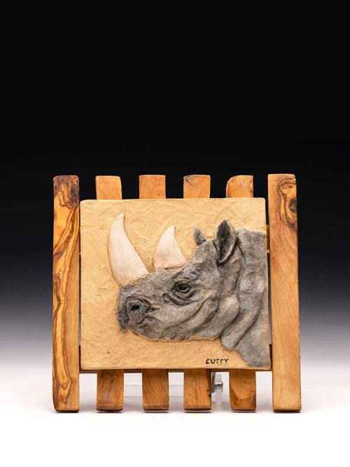 Rhino relief tile by artist Tina Curry.