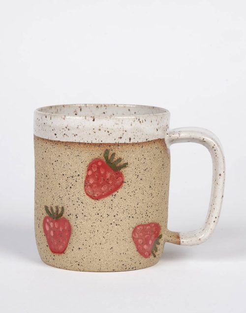 A ceramic strawberry stamped mug by Osso Ceramics.