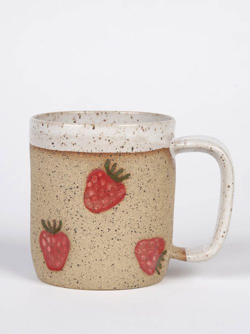 A ceramic strawberry stamped mug by Osso Ceramics.