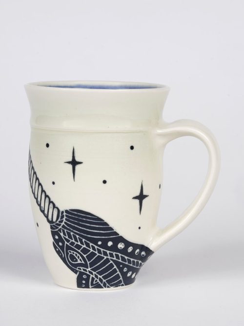 Ceramic darkstar narwhal mug by Asheville artist Anja Bartels.