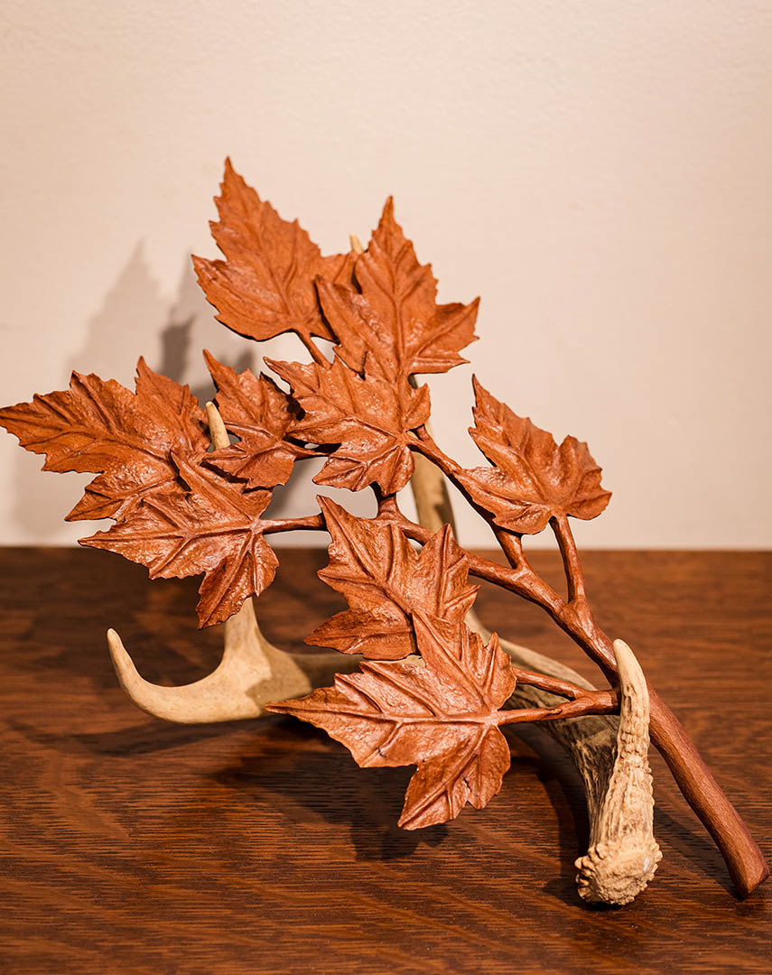 Antler with mple branch by Joel Rakower.