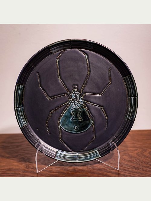 Pewter and green spider plate by Leslie Green Guilbault.