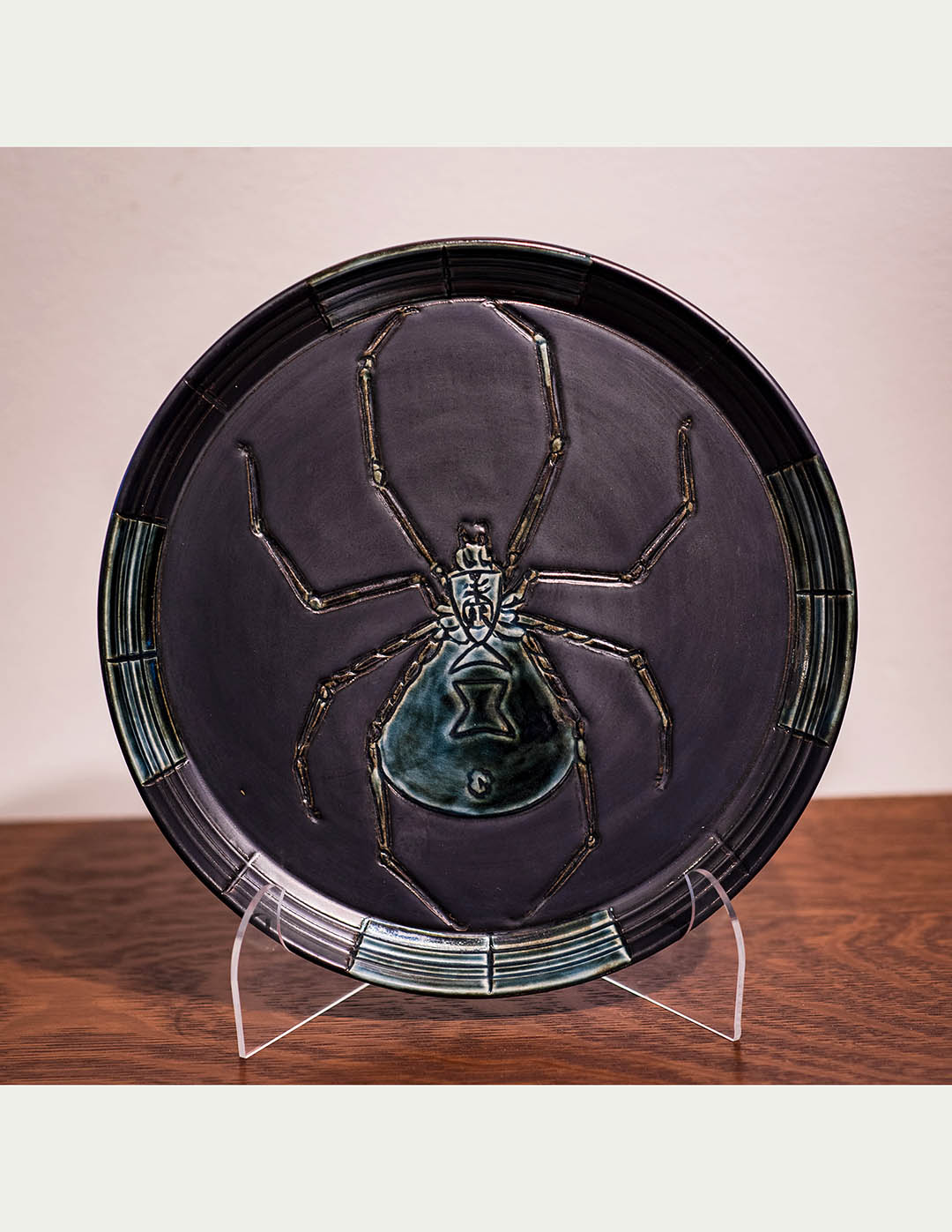 Pewter and green spider plate by Leslie Green Guilbault.