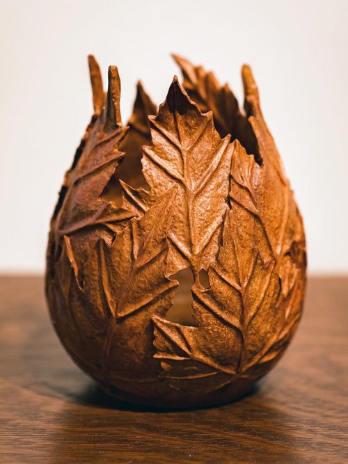 Sculptural maple leaf vessel made from carved cherry by Joel Rakower.