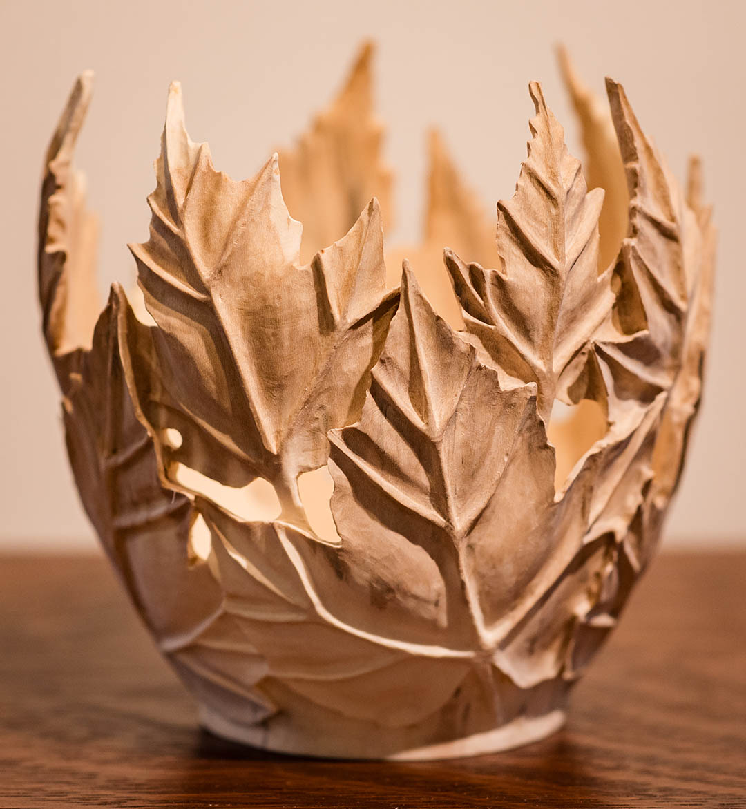 Sculptural maple leaf vessel carved from holly wood by Joel Rakower.