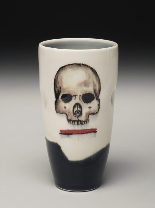 A porcelain skull tumbler by North Carolina artist Phil Haralam.