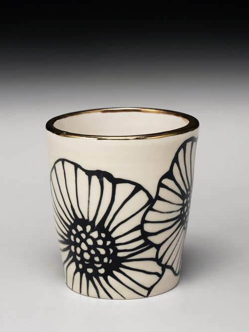 A stoneware floral tumbler by Nicole Hsieh.