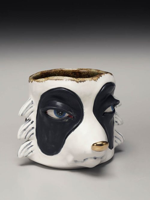 Poreclain raccoon mug handmade by Taylor Robenalt.