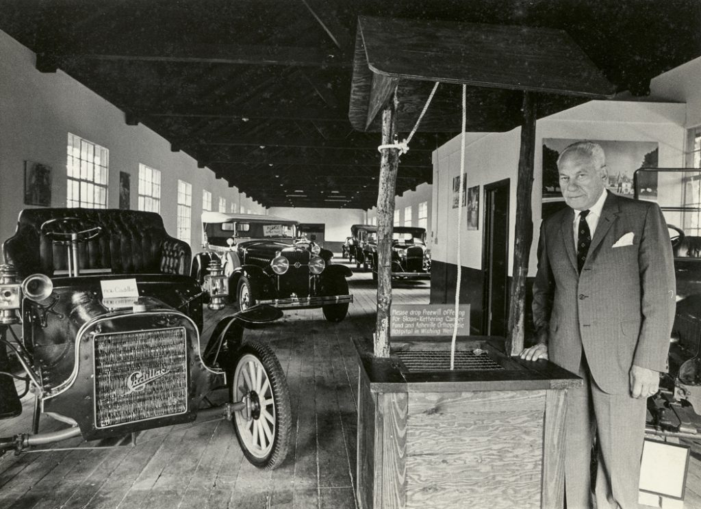 Founder Harry Blomberg in the Estes-Winn Antique Car Museum.