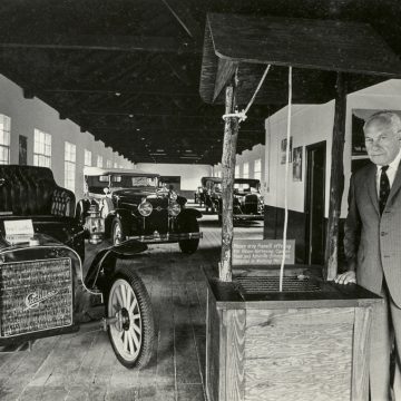 Founder Harry Blomberg in the Estes-Winn Antique Car Museum.