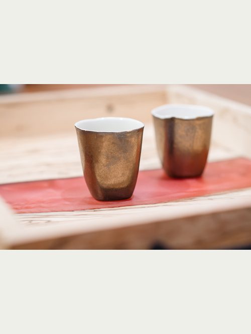 Petite gold cups by artist Lisa GLuckin.