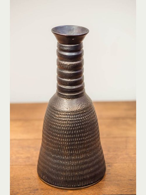 Large carved metallic vase by leslie green guilbault.