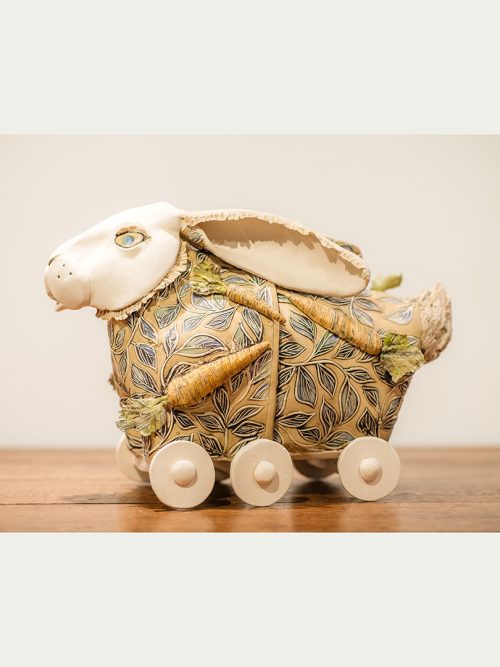 Ceramic rabbit sculpture by Libba Tracy titled Hare Today, Gone Tomorrow.