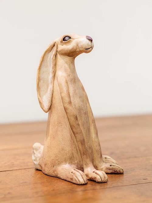 Ceramic hare sculpture side view by artist Tina Curry.