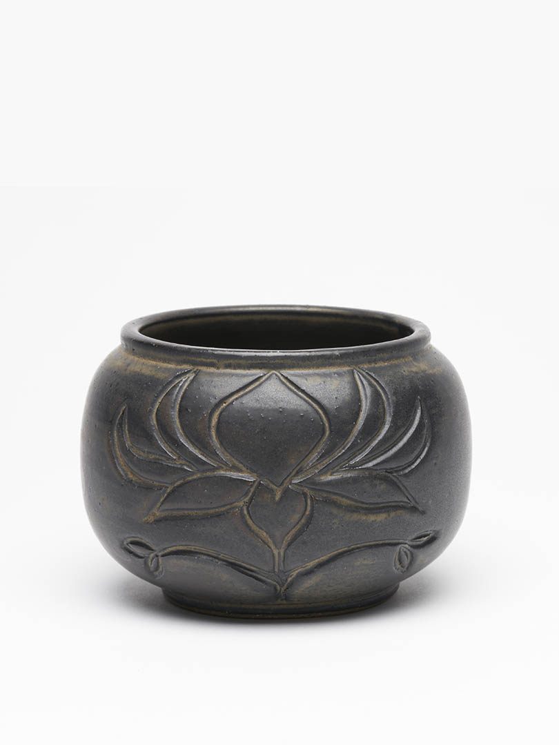 Carved low gunmetal vase by artist Leslie Green Guilbault.