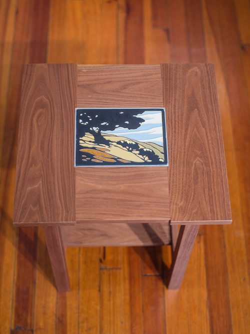 A walnut table with a motawi tile insert by Tim Livingston.