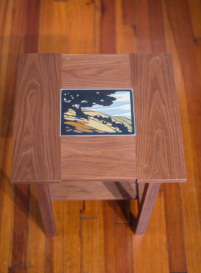 A walnut table with a motawi tile insert by Tim Livingston.